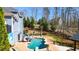 Backyard with in-ground pool, slide, well-manicured landscaping and outdoor living area at 114 Hardwood Ln, Canton, GA 30115