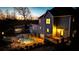 Night view of an in-ground pool and lighted deck area outside of the home at 114 Hardwood Ln, Canton, GA 30115