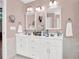 Bathroom features a white double vanity with mirrors and sconces at 114 Hardwood Ln, Canton, GA 30115