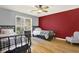 Shared bedroom showcasing two beds, a ceiling fan, and natural light from the window at 114 Hardwood Ln, Canton, GA 30115