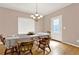Inviting dining room features wood floors and natural light at 114 Hardwood Ln, Canton, GA 30115