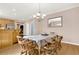 Dining room features wood table and chairs, chandelier, and wood flooring at 114 Hardwood Ln, Canton, GA 30115