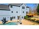 Two-story home with a private backyard featuring a pool with slide and a patio area at 114 Hardwood Ln, Canton, GA 30115
