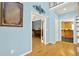 Light filled foyer with hardwood floors and entry to the kitchen and living room at 114 Hardwood Ln, Canton, GA 30115
