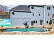 Backyard pool featuring a slide and a mural, perfect for Gathering fun and relaxation at 114 Hardwood Ln, Canton, GA 30115