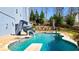 Backyard pool with a slide and diving board, surrounded by well-manicured landscaping at 114 Hardwood Ln, Canton, GA 30115