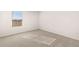 Bright bedroom with a window and neutral carpeting at 1622 Palladian Way, Lithonia, GA 30058