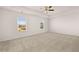 Large bedroom with tray ceilings and a ceiling fan at 1622 Palladian Way, Lithonia, GA 30058