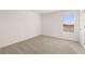 Bedroom with a window and neutral carpeting at 1622 Palladian Way, Lithonia, GA 30058