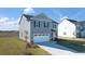 Attractive two-story home features a two-car garage, lush lawn, and a modern exterior at 1622 Palladian Way, Lithonia, GA 30058