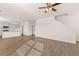 Open-concept living area with hardwood floors leading to the kitchen and staircase at 1622 Palladian Way, Lithonia, GA 30058