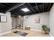 Finished basement with a ceiling light, art, and flooring at 3263 Dodson Dr, Atlanta, GA 30344