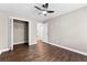 Bedroom features ceiling fan, hardwood floors, and closet with ample storage space at 3263 Dodson Dr, Atlanta, GA 30344