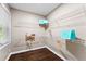 Walk-in closet with wood floors, shelving, and window that provides natural light at 3263 Dodson Dr, Atlanta, GA 30344