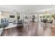 Spacious living room boasts hardwood floors and seamlessly connects to an open concept kitchen and dining area at 3263 Dodson Dr, Atlanta, GA 30344