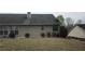 Backyard featuring trimmed bushes and green grass at 5763 Dexters Mill Pl, Buford, GA 30518