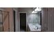 Bathroom with double sinks, modern vanity, and a glass-enclosed shower at 5763 Dexters Mill Pl, Buford, GA 30518