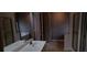Bright bathroom with a soaking tub, double shower, and double vanity with a granite countertop at 5763 Dexters Mill Pl, Buford, GA 30518