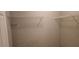 Walk-in closet with white walls and wire shelving at 5763 Dexters Mill Pl, Buford, GA 30518