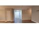 Inviting entryway featuring light gray walls, wood floors, and a bright white front door at 5763 Dexters Mill Pl, Buford, GA 30518