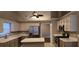 Well-lit kitchen featuring an island, stainless steel appliances, neutral cabinets and countertops at 5763 Dexters Mill Pl, Buford, GA 30518