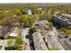 Aerial view showcases the townhome, neighborhood, and surrounding lush greenery and nearby amenities at 1078 Piedmont Ne Ave # 203, Atlanta, GA 30309