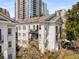 Beautiful white brick townhome with balconies, landscaped grounds and city views at 1078 Piedmont Ne Ave # 203, Atlanta, GA 30309