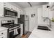 Updated kitchen featuring stainless steel appliances, white countertops, and ample cabinet space at 1078 Piedmont Ne Ave # 203, Atlanta, GA 30309