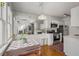 Bright kitchen featuring white cabinets, stainless appliances, and open dining area at 1078 Piedmont Ne Ave # 203, Atlanta, GA 30309