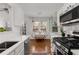 Modern kitchen with white countertops, stainless steel appliances, and a cozy breakfast nook at 1078 Piedmont Ne Ave # 203, Atlanta, GA 30309