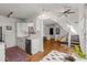 Well-lit kitchen with white cabinetry, stainless steel appliances, and view of the living room at 1078 Piedmont Ne Ave # 203, Atlanta, GA 30309