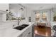 Modern kitchen with stainless steel appliances, white cabinets, and an open view to the dining area at 1078 Piedmont Ne Ave # 203, Atlanta, GA 30309