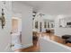 Open-concept living room featuring hardwood floors and a bathroom adjacent to the entrance at 1078 Piedmont Ne Ave # 203, Atlanta, GA 30309