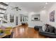Bright living room with hardwood floors, a ceiling fan, and an adjacent kitchen view at 1078 Piedmont Ne Ave # 203, Atlanta, GA 30309