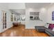 Bright living area with hardwood floors, modern sofa, and view into kitchen and dining area at 1078 Piedmont Ne Ave # 203, Atlanta, GA 30309