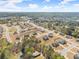 An aerial view showcases a residential neighborhood with lush greenery, showcasing a community pool and spacious lots at 125 Whitman Grv, Fayetteville, GA 30215