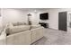 Spacious basement featuring a large sofa and entertainment area at 125 Whitman Grv, Fayetteville, GA 30215