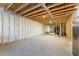 Unfinished basement with exposed framing and ample space for customization at 125 Whitman Grv, Fayetteville, GA 30215