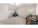Bright room with neutral carpet and a tent and a baby crib with a teddy bear at 125 Whitman Grv, Fayetteville, GA 30215