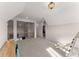 Bright bonus room with neutral carpet, recessed lighting and wrought iron banister overlooking the main floor at 125 Whitman Grv, Fayetteville, GA 30215