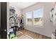 Walk-in closet with laminate flooring, a window, and wire shelving provides plenty of storage at 125 Whitman Grv, Fayetteville, GA 30215
