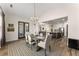 Bright dining room features an elegant chandelier and flows into the spacious kitchen at 125 Whitman Grv, Fayetteville, GA 30215
