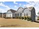 Well-maintained home with stone accents, shutters, and a spacious front yard at 125 Whitman Grv, Fayetteville, GA 30215