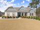 Beautiful home with stone accents, shutters, covered porch, and a well-kept lawn at 125 Whitman Grv, Fayetteville, GA 30215