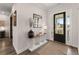 Elegant foyer featuring hardwood floors, decorative console table, and a welcoming entrance at 125 Whitman Grv, Fayetteville, GA 30215