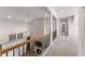 Hallway overlooking a living room with fireplace and lots of natural light at 125 Whitman Grv, Fayetteville, GA 30215