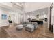 Spacious living room with hardwood floors, kitchen view, and bright lighting throughout at 125 Whitman Grv, Fayetteville, GA 30215