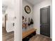Welcoming mudroom features shiplap accent wall, a bench, and storage for an organized entrance at 125 Whitman Grv, Fayetteville, GA 30215
