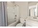 Bright bathroom featuring a shower-tub combo with white tile and a modern toilet at 2030 Main Nw St # 207, Atlanta, GA 30318
