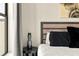 Close up of main bedroom, showing the pillows, side table and window at 2030 Main Nw St # 207, Atlanta, GA 30318